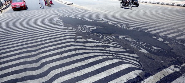 In India last May, temperatures rose to 120°F (50°C), killing more than 2,300 people—and melting this street in New Delhi (Image: H. Tyagi/EPA)