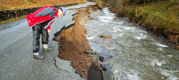 A Cumbria road destroyed in floods during storm Desmond, which scientists found had been made more likely by climate change (Image: A. Cooper/Barcroft Media)